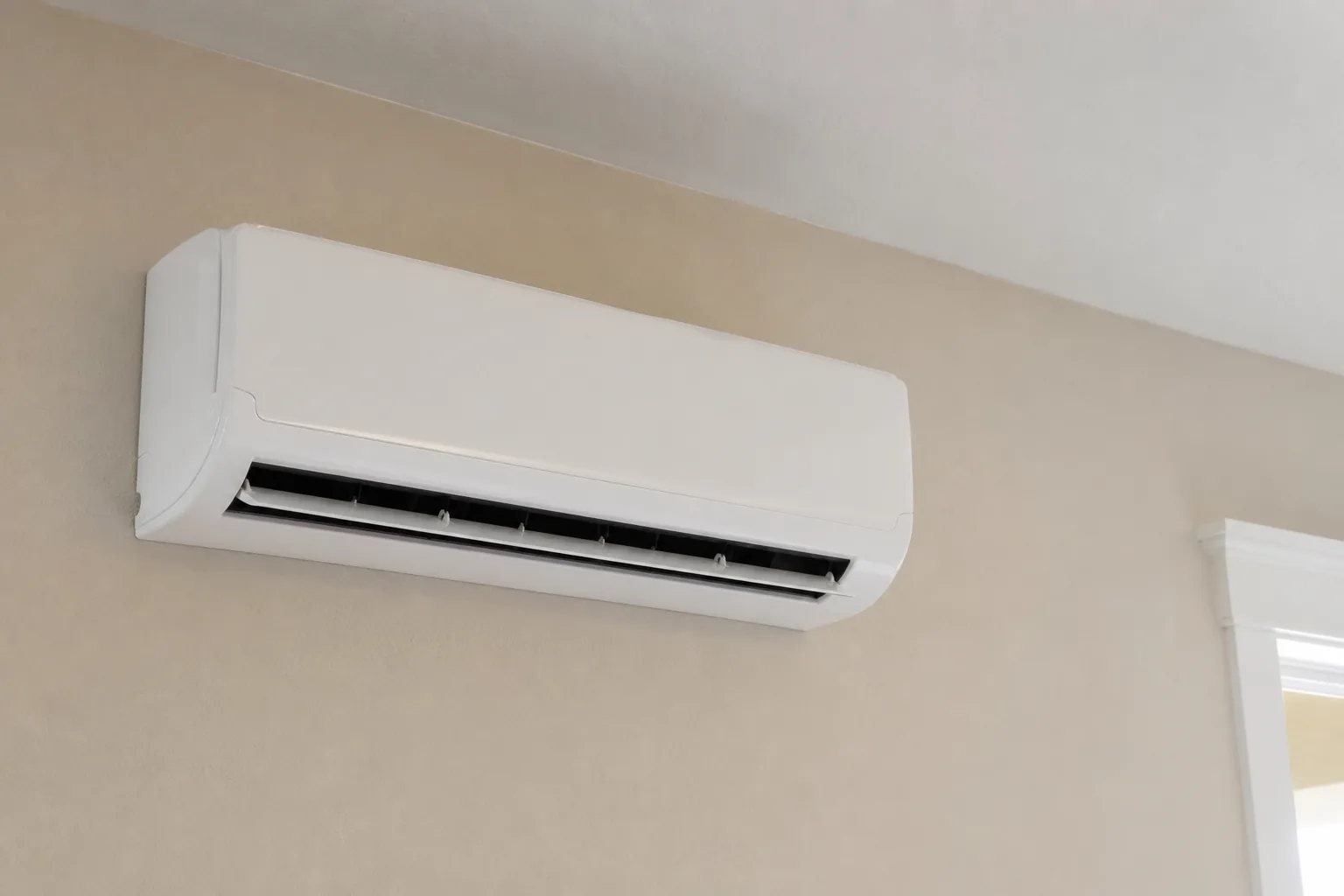 Newly installed ductless mini-split in a Bay Minette home interior wall, routine check