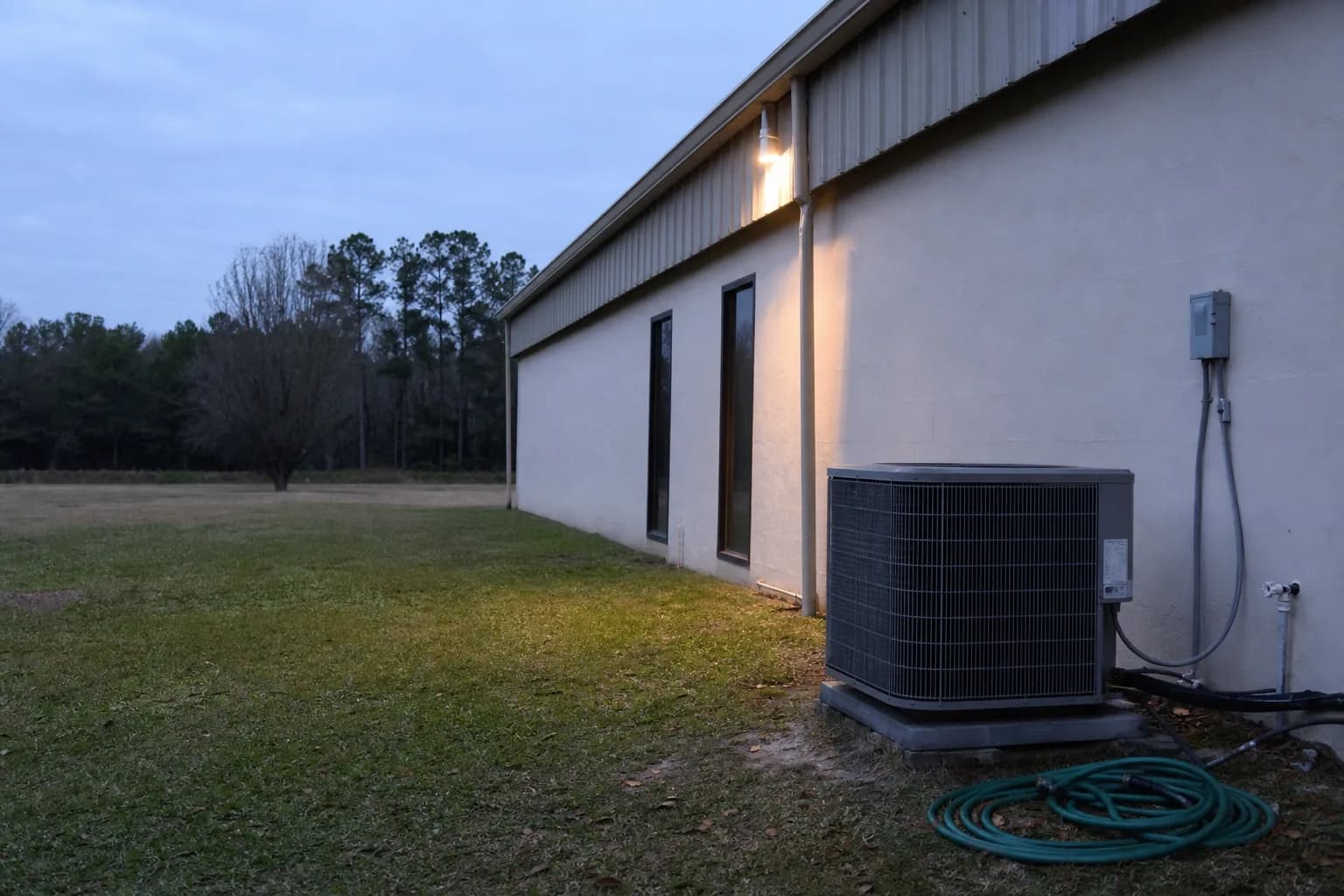 AC unit being maintained at a Silverhill inland Baldwin County home, condenser detail, summer