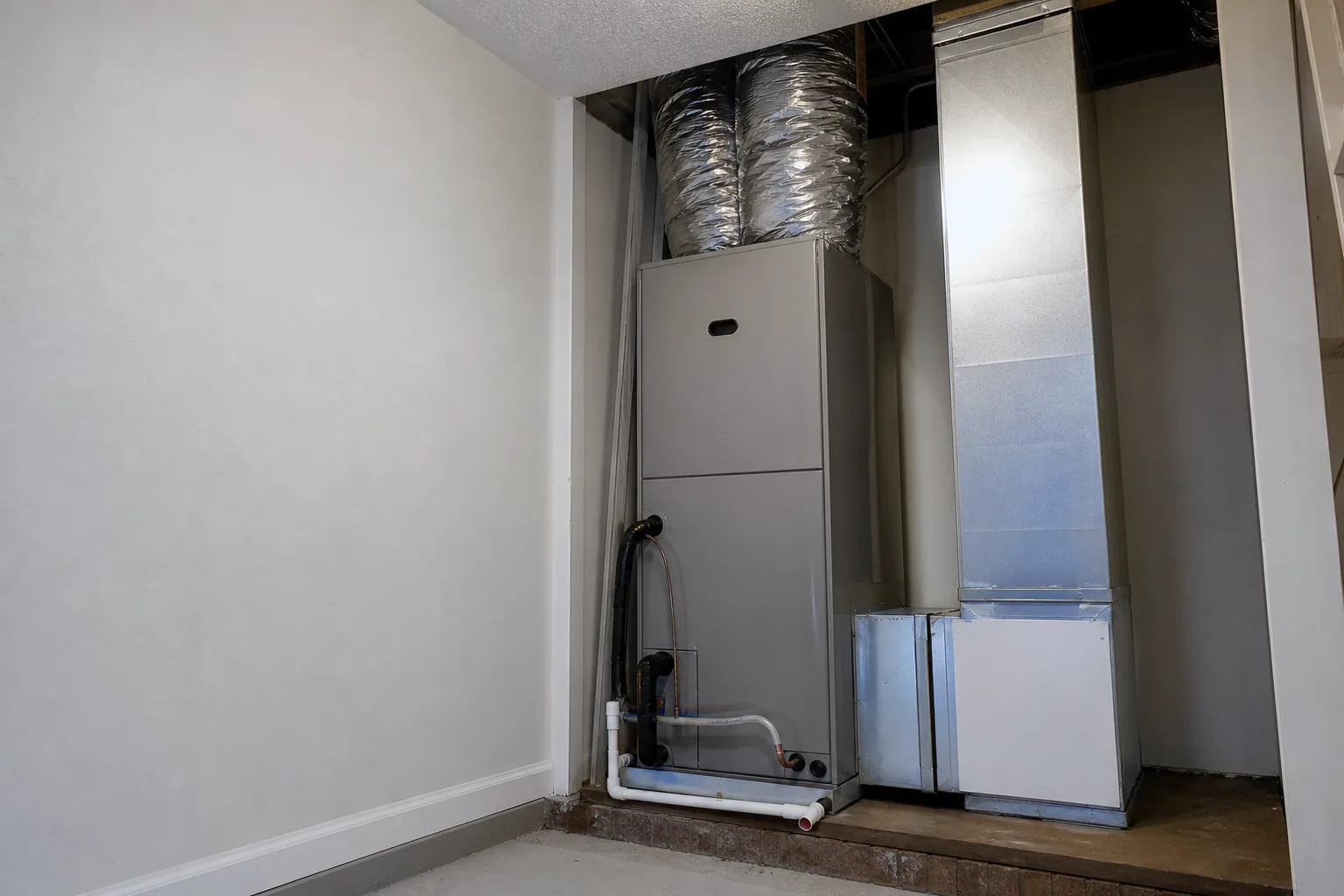 Newly installed indoor air handler in a Silverhill home back room, comfort-control view