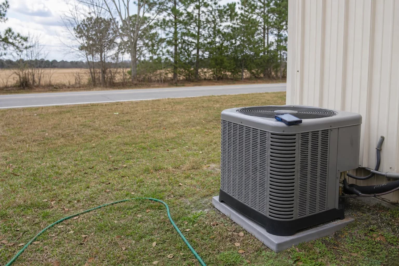 HVAC unit on an after-hours call at a Bay Minette inland Baldwin County home, condenser detail, winter