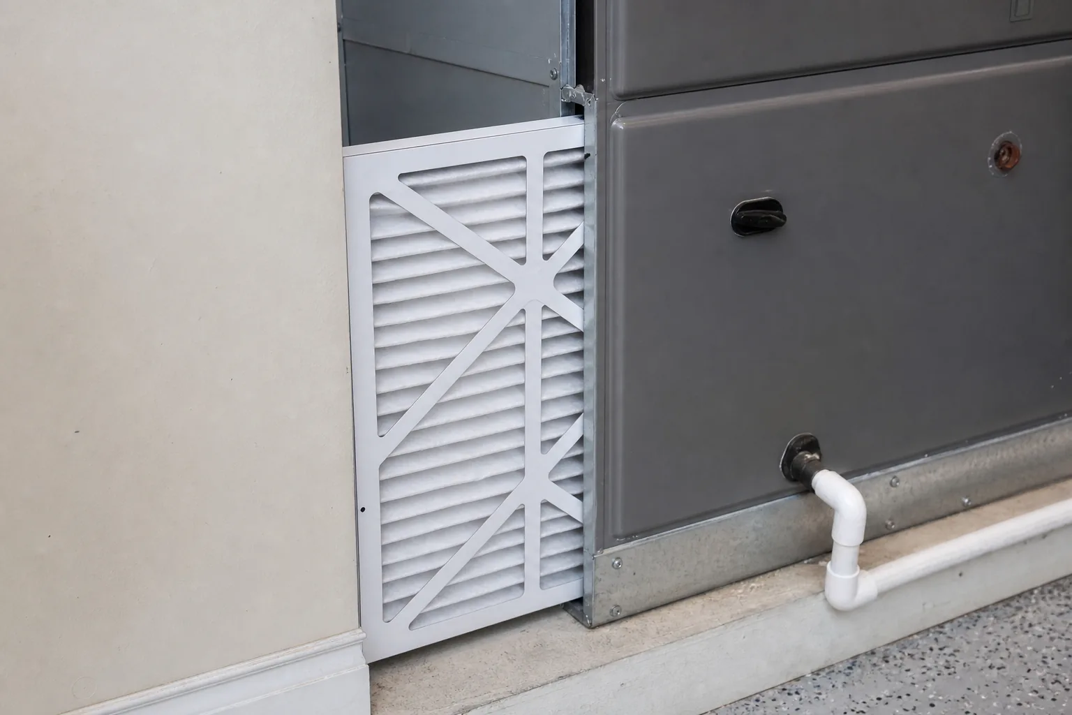 Indoor air handler and filter in a Gulf Shores home garage, install detail
