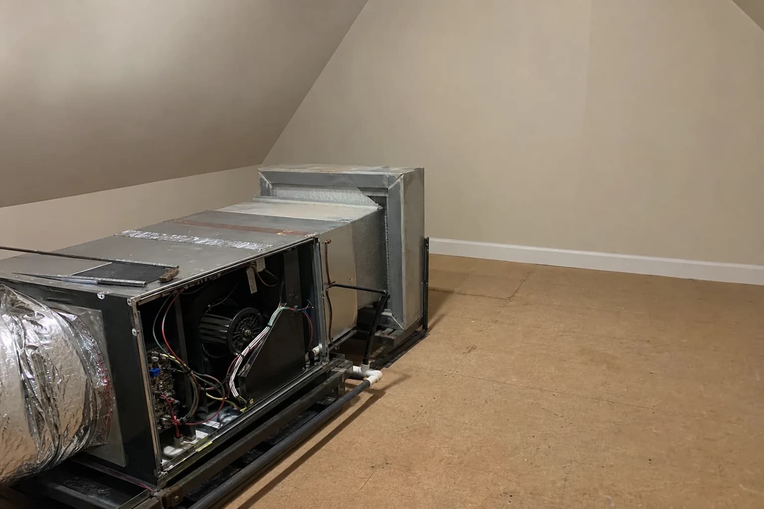 Gas furnace being serviced in a Daphne home bonus room, wiring detail