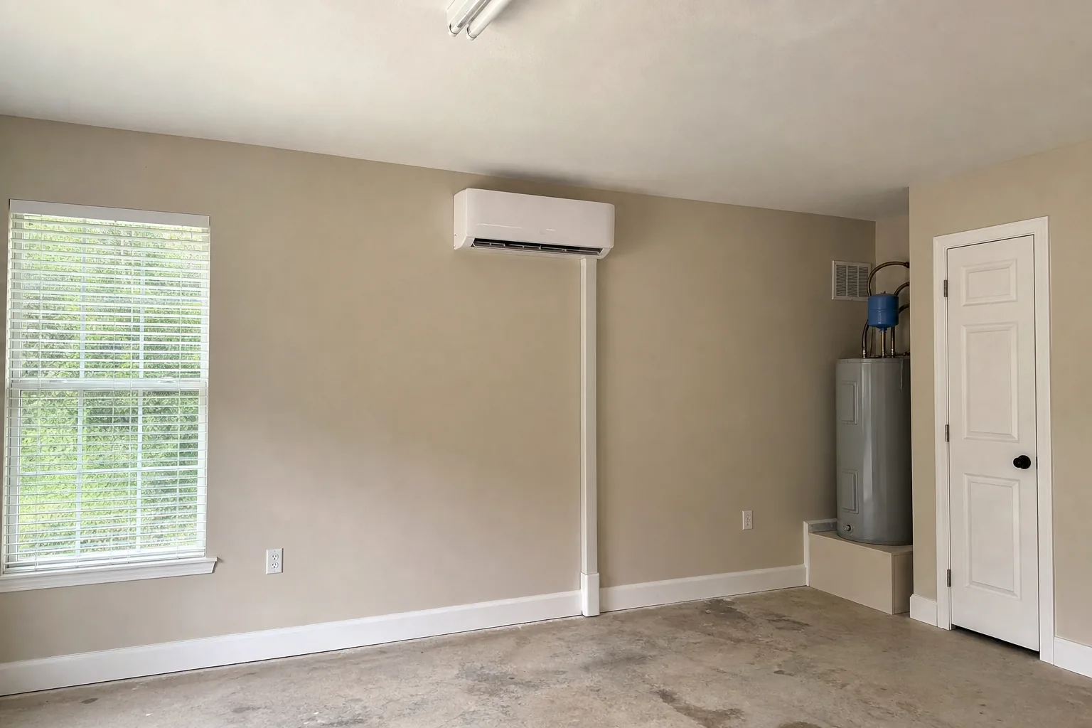 Newly installed ductless mini-split in an Orange Beach home mechanical room, plenum detail