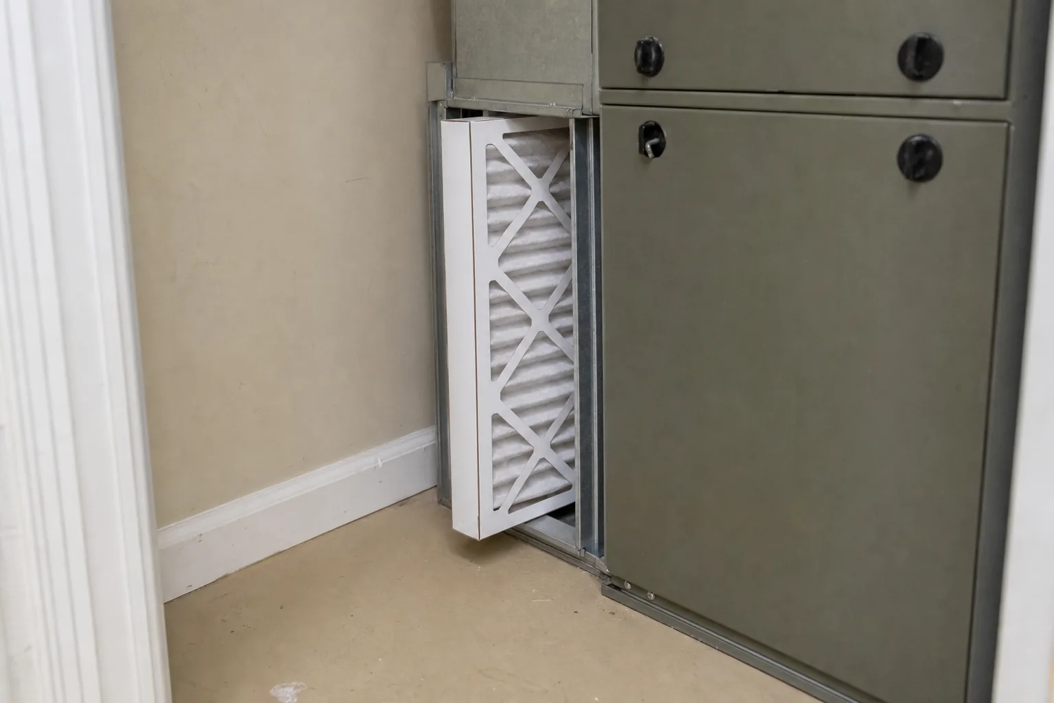 Indoor air handler and filter in a Spanish Fort home back room, filter detail
