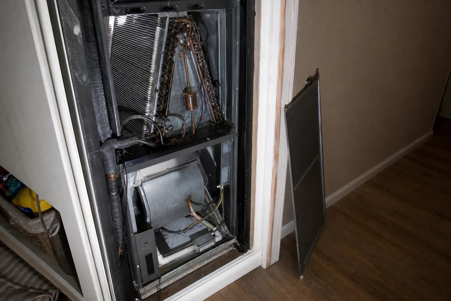 Indoor air handler being serviced in an Orange Beach home interior wall, filter detail
