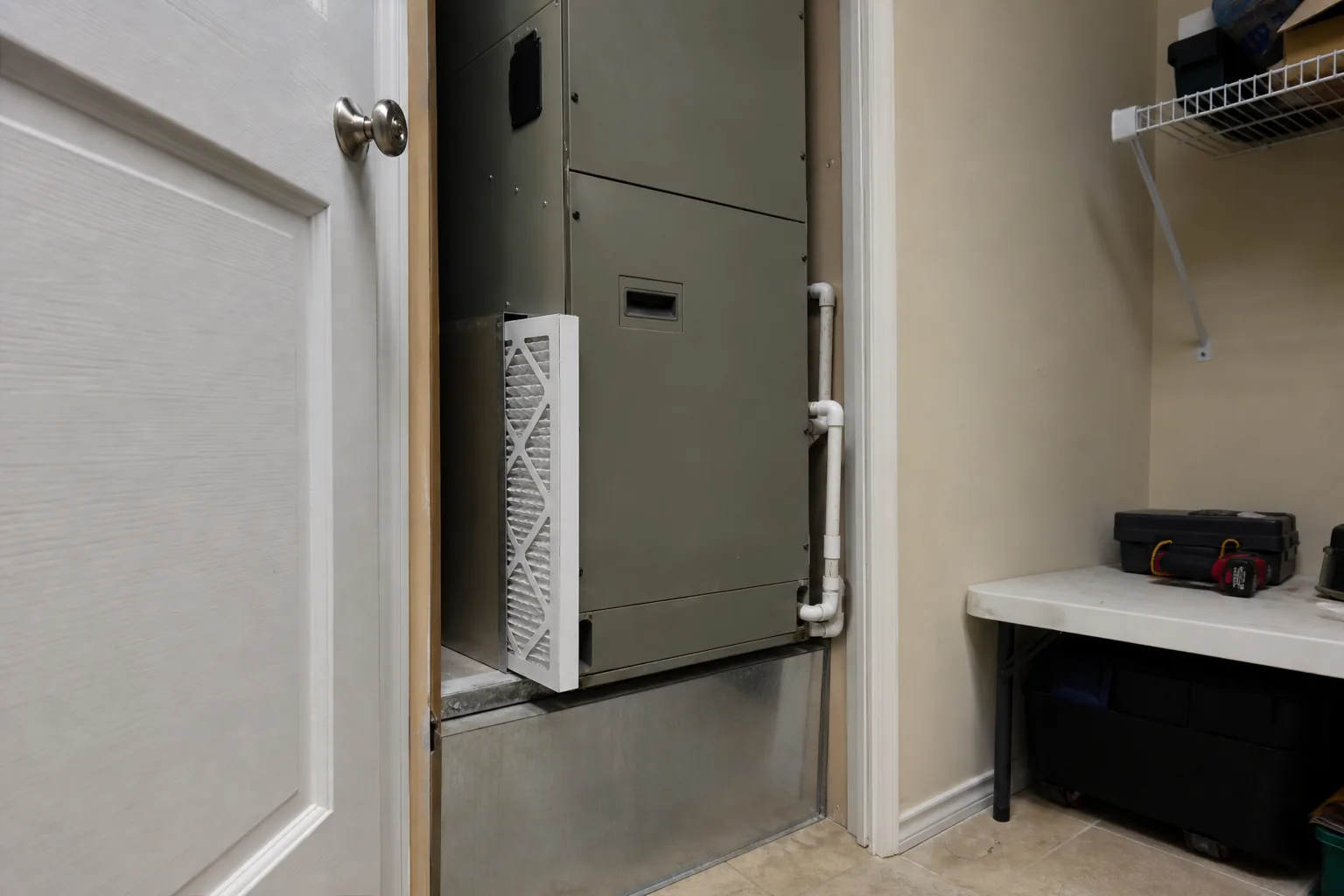 Indoor air handler and filter in a Bay Minette home back room, interior view