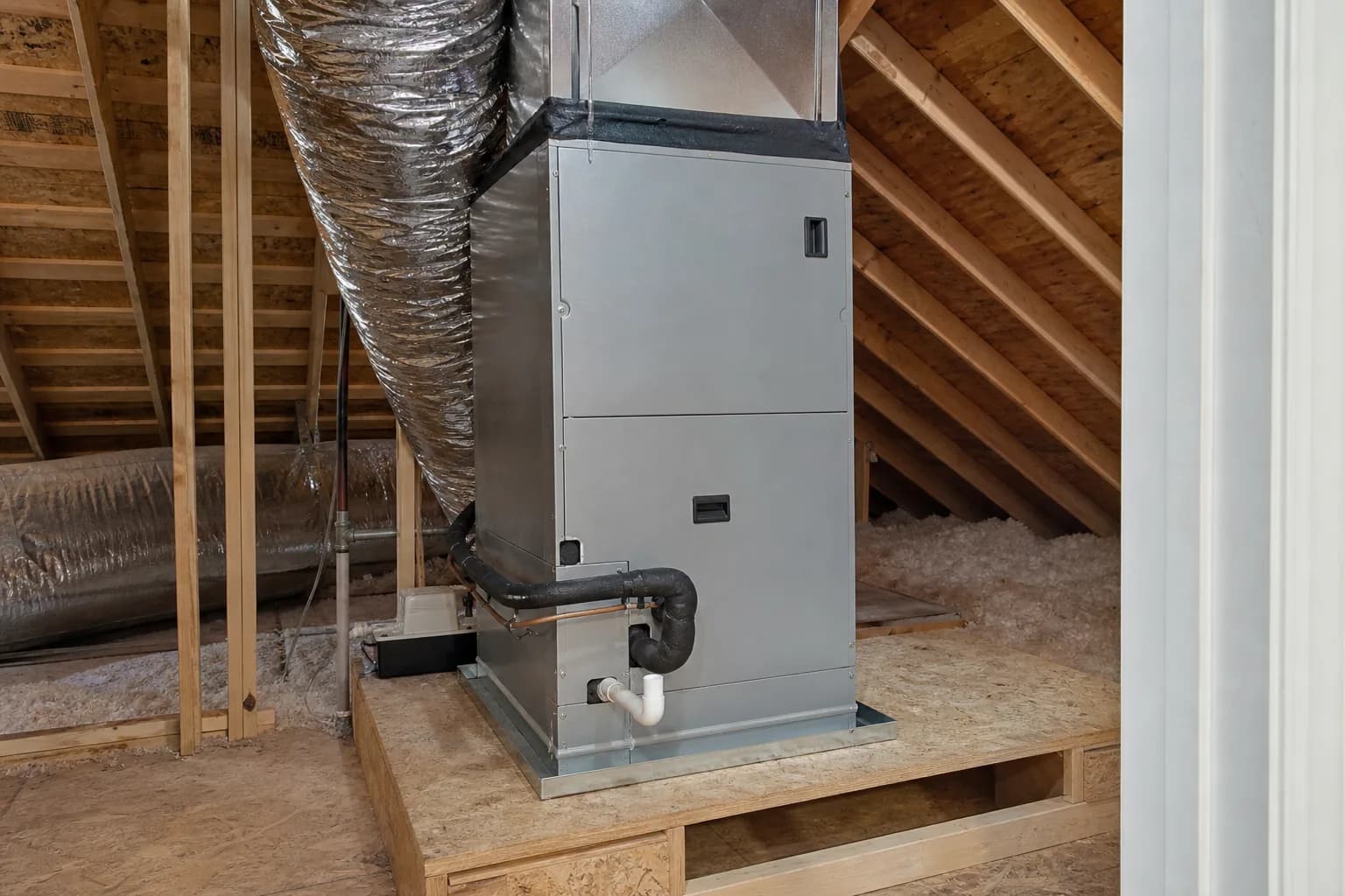 Newly installed indoor air handler in a Gulf Shores home attic, service view