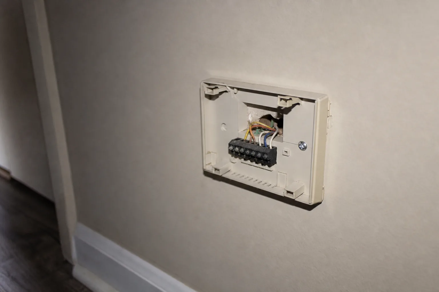 Indoor air handler being serviced in a Robertsdale home interior wall, wiring detail