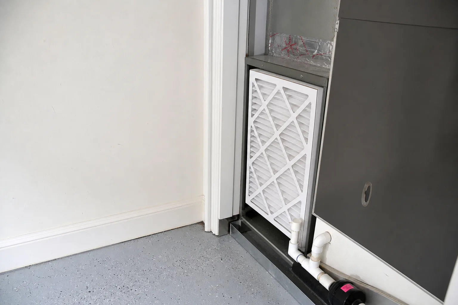 Indoor air handler and filter in a Spanish Fort home garage, fresh-filter view
