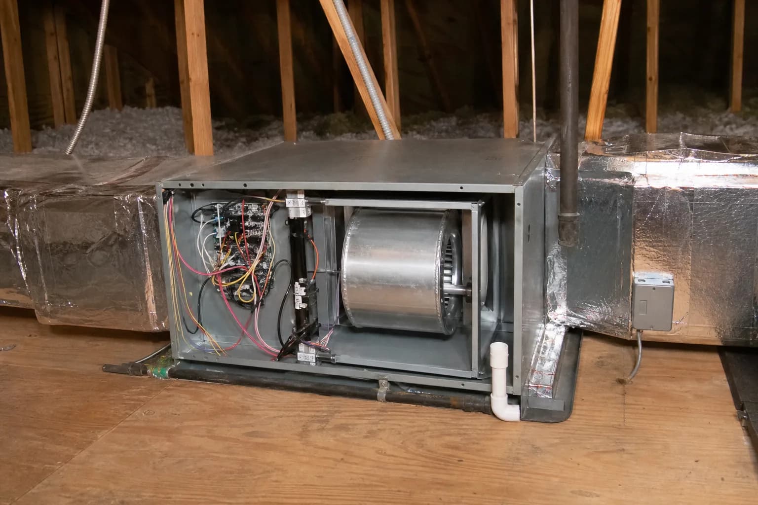 Gas furnace being serviced in a Stapleton home utility closet, install detail