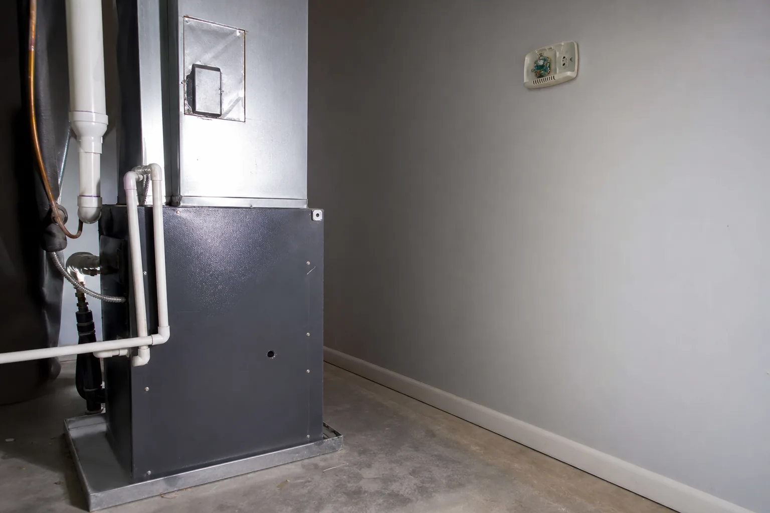 Indoor air handler being serviced in a Bay Minette home garage, wiring detail