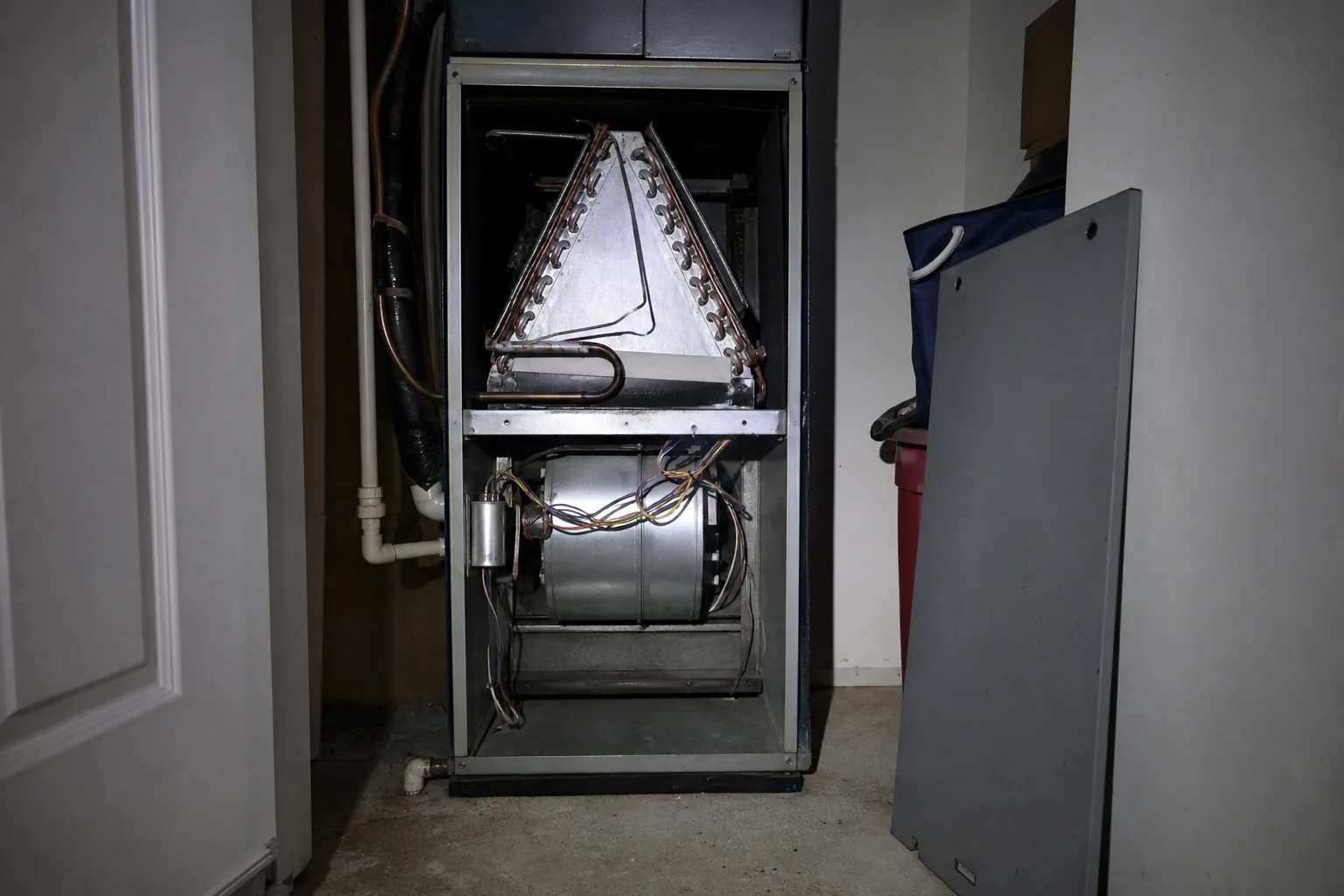 Indoor air handler being serviced in a Daphne home mechanical room, install detail
