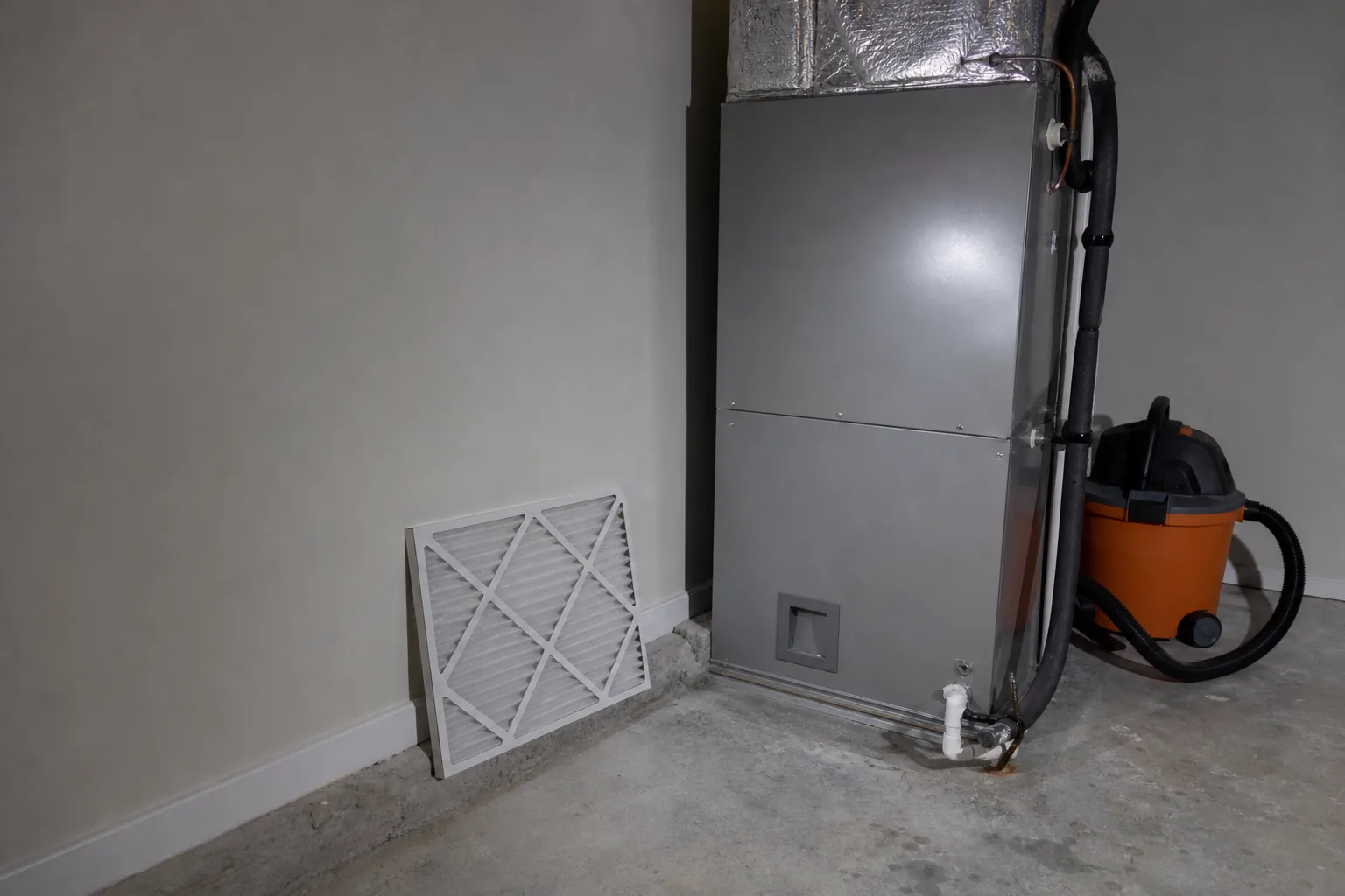 Indoor air handler and filter in a Silverhill home back room, install detail