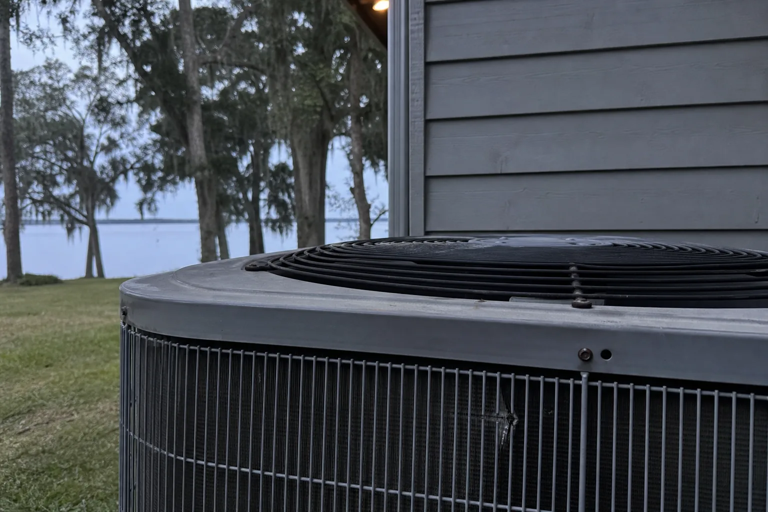 AC condenser being serviced at a Daphne Mobile Bay home, service view, fall