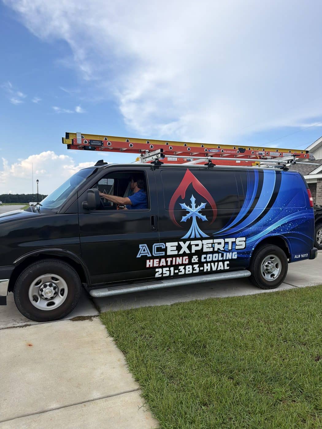 ACExperts service van parked in a Baldwin County residential driveway